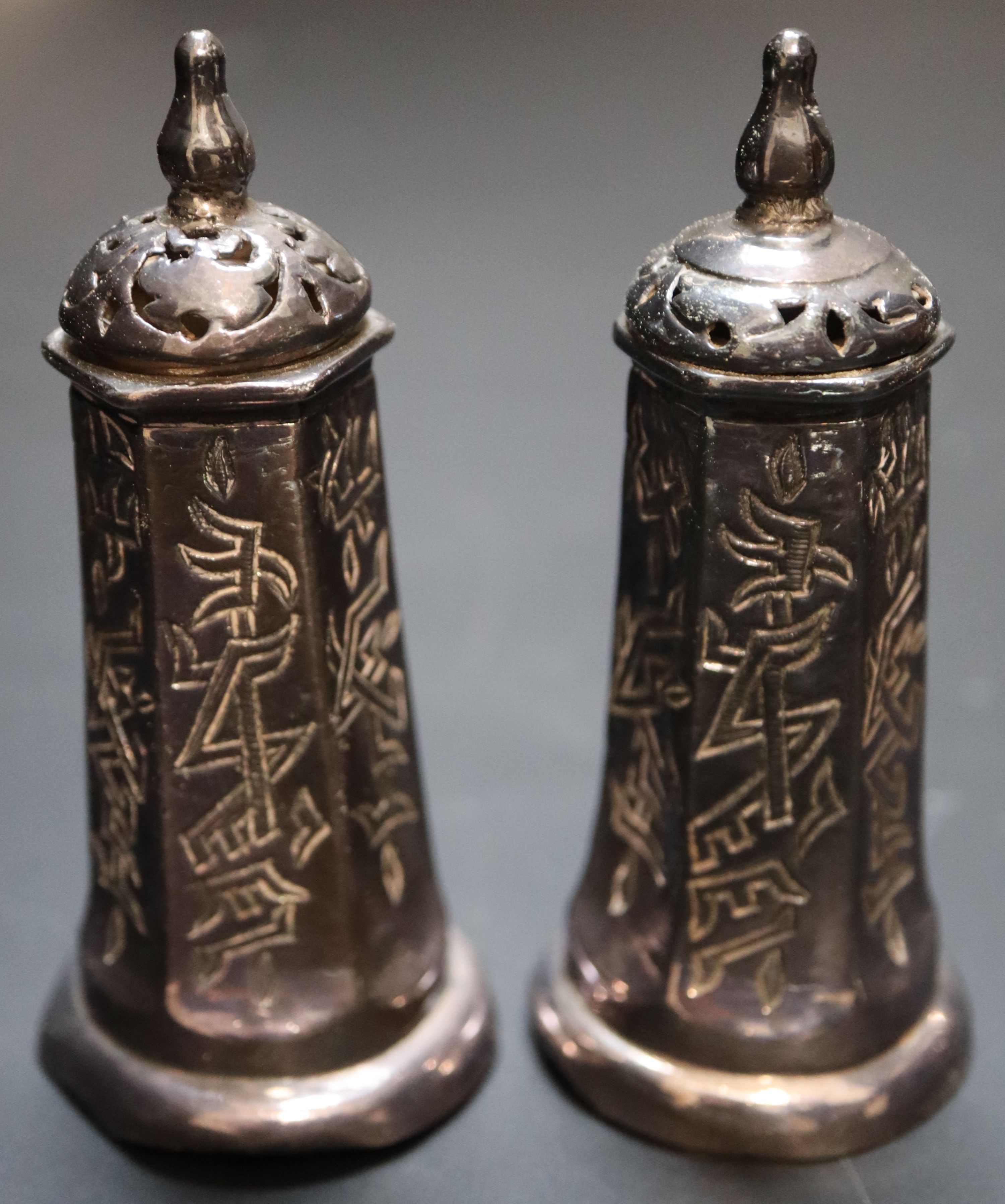 A group of condiments including Chinese and ivory and a table bell